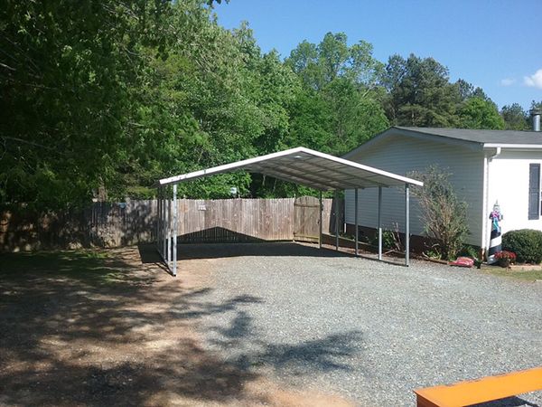 carport in gravel driveway